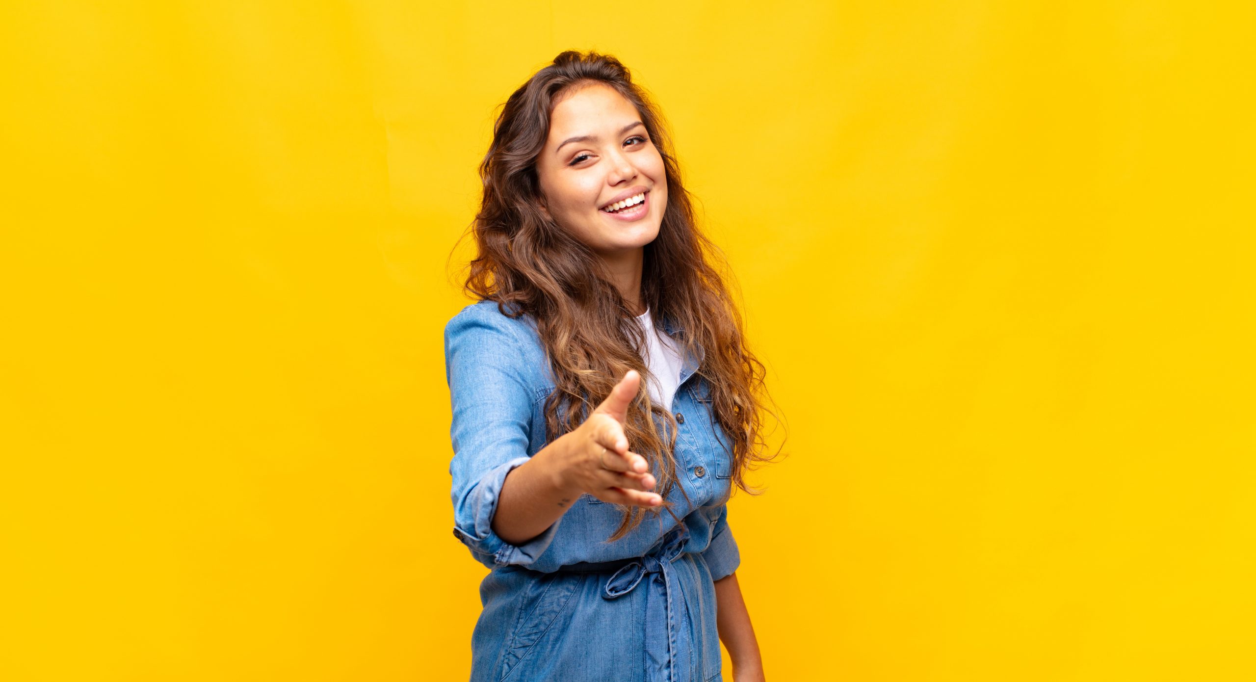 smiling, looking happy, confident and friendly, offering a handshake to close a deal, cooperating